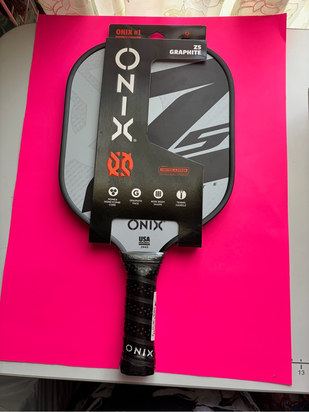 Onix Graphite Z5 Pickleball Paddle in Black and Gray with Orange Logo